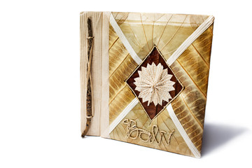 Picture album made completely from a tree. An inscription on a c