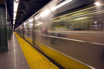 New York subway speeding by a platform