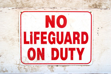 Sign saying "No Lifeguard on Duty"