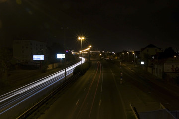 Fototapeta na wymiar Motorway, traffic at nightfall