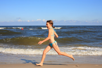 Girl running on beach