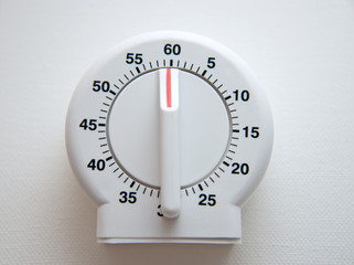 white kitchen timer set at 60 minutes