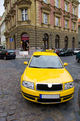 Yellow taxi wide angle view