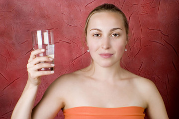 Young woman drinking water. Woman With Water Glass. 