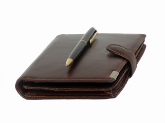 brown leather wallet with a pen