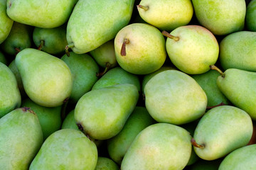 Green delicious pears at the market place
