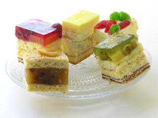 multicolour fruit cake on cristal plate