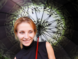 Smiling happy girl with umberella