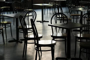 Foto op Plexiglas Tables and chairs in a cafeteria © Studio Light & Shade