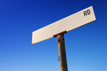 Sign against blue sky