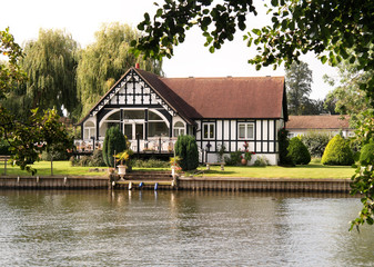 Fototapeta na wymiar Timber Framed House on the banks of the River Thames