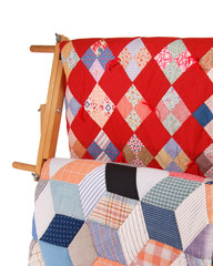 Two Quilts On A Wood Rack