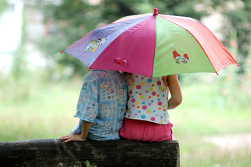Children under umbrella