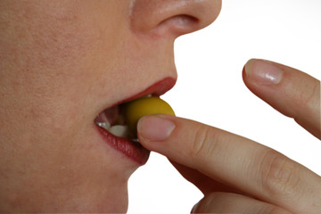 woman eating olive