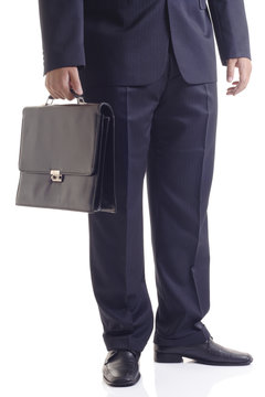 Businessman with a suitcase against white background