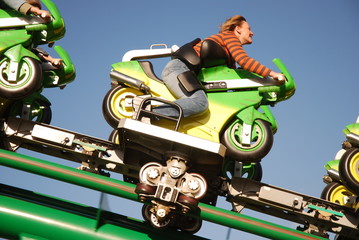 woman sitting on motor in a rollercoaster