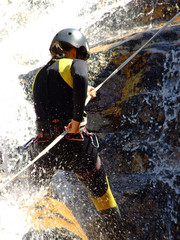 Woman descending on rappel
