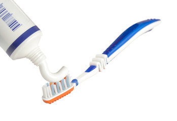 Toothpaste being applied on a toothbrush 