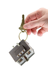 Hand holding house keys on key ring