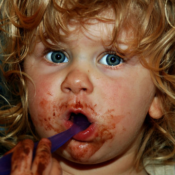 Child Face Full Of Chocolate