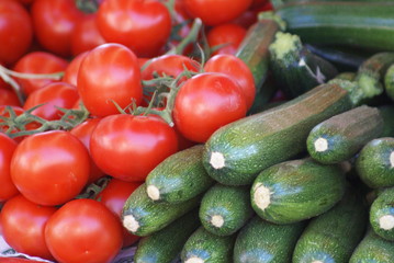 Tomatoes and courgette on market stool