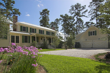 large affluent home with landscaping