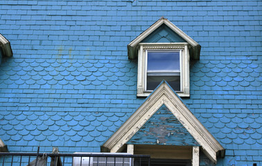 Dormer window on blue rooftop