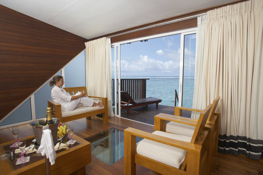 woman in water bungalow