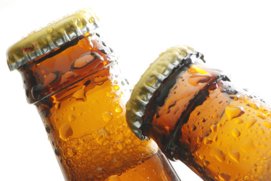 Top of beer&acute;s bottles close