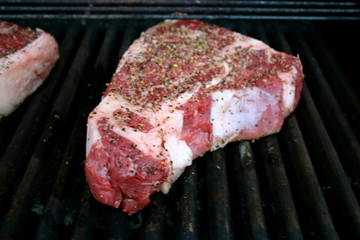 Thick Porterhouse Steaks on the Barbecue