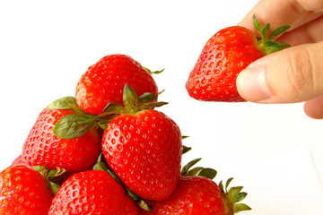 hand holding the strawberry