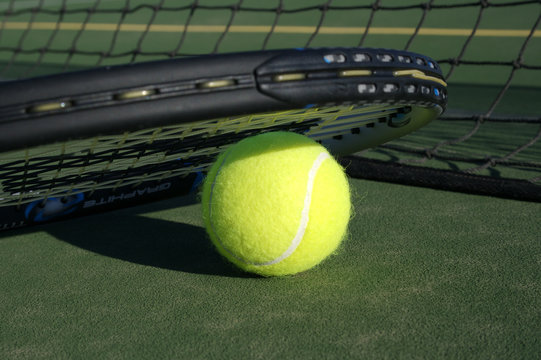 Tennis Ball & Recket on Tennis Court