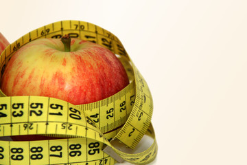 apple with metric ribbon