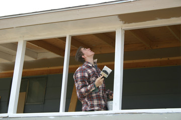 Boy Painting Porch