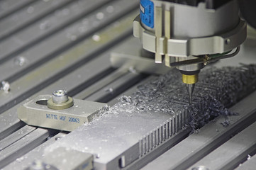 Drilling Machine automatically processing a metallic part.