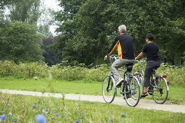 Naklejka premium Biking Seniors In The Park