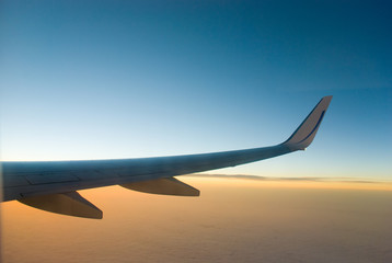 airplane wings in the clouds