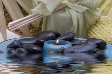 Spa candle and stones