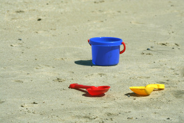 Fototapeta na wymiar Shovels and pail on the beach