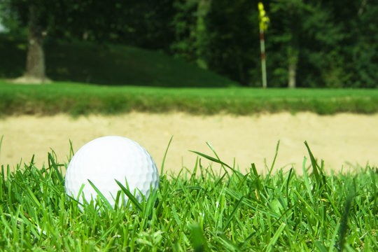 Golf Ball In Front Of Green Bunker