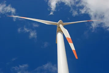 Fototapete Mühlen up perspective of wind mill power generator against blue sky
