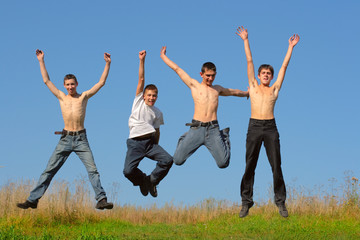 Fototapeta na wymiar happy boys jumping
