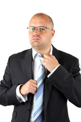Stressed Businessman Loosening His Tie