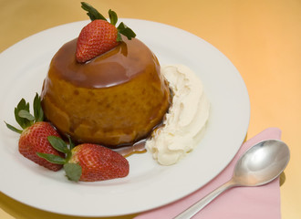 caramel sponge pudding aligned left with gold background