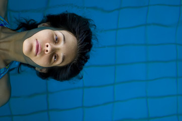 Young girl relaxing in pool 03