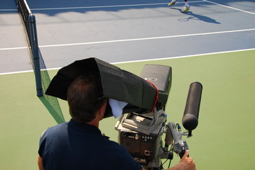 filming a tennis match