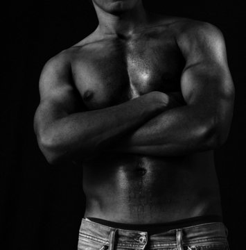 Handsome black muscular male body tough
