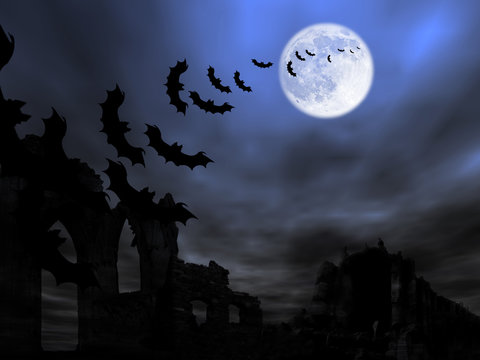 Halloween theme: bats flying over the old ruin against the Moon