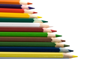 Assortment of coloured pencils isolated over white
