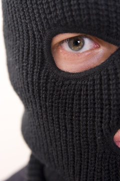 evil criminal wearing military mask